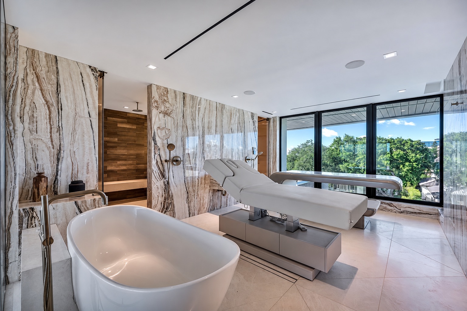 Private spa bathroom with freestanding tub and marble walls