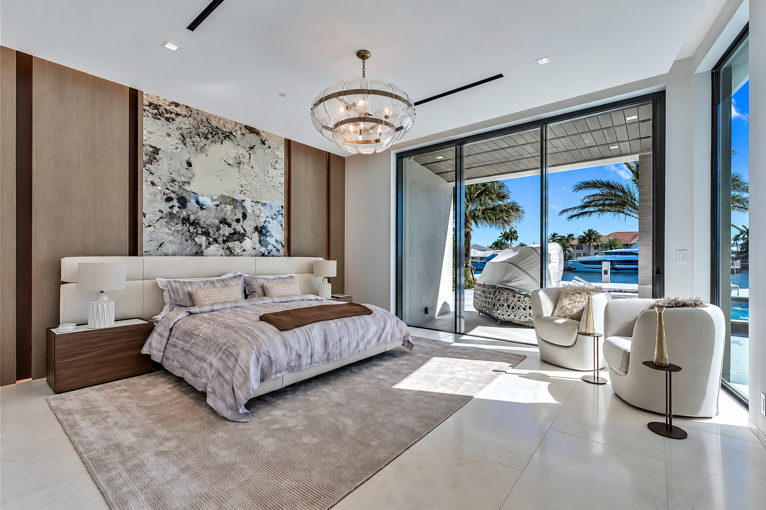 Bedroom suite with marble feature wall and sculptural chandelier