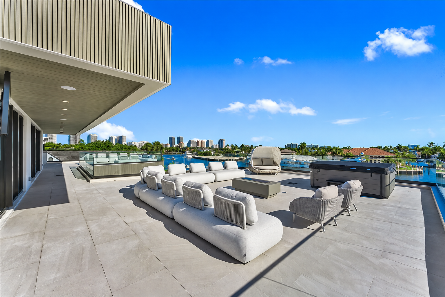 Rooftop terrace with outdoor seating and spa overlooking the intracoastal